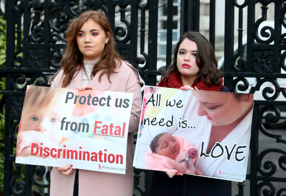 Pro-life, anti-abortion activists hold placards as they protest outside of Belfast High court in Belfast, Northern Ireland, UK, on Jan. 30, 2019. (Paul Faith /AFP via Getty Images)