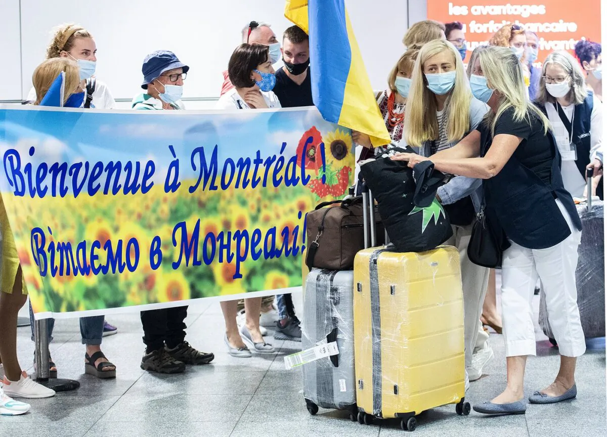 Ukrainian nationals fleeing the ongoing war in Ukraine arrive at Trudeau Airport in Montreal, May 29, 2022. (The Canadian Press/Graham Hughes)