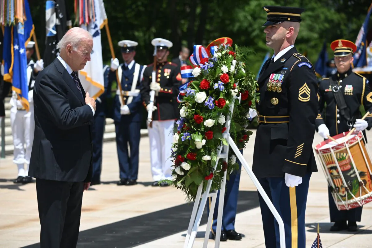 President Joe Biden participates in a wreath laying ceremony at the Tomb of the Unknown Soldier in honor of Memorial Day at Arlington National Cemetery in Arlington, Va., on May 30, 2022. (Saul Loeb/AFP via Getty Images)