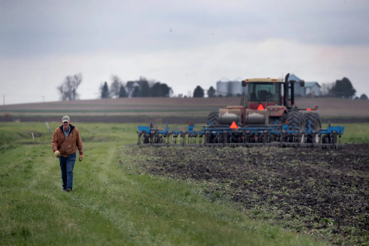 A farmer puts fertilizer in the ground before it is planted, near Dwight, Ill., on April 23, 2020. (Scott Olson/Getty Images)