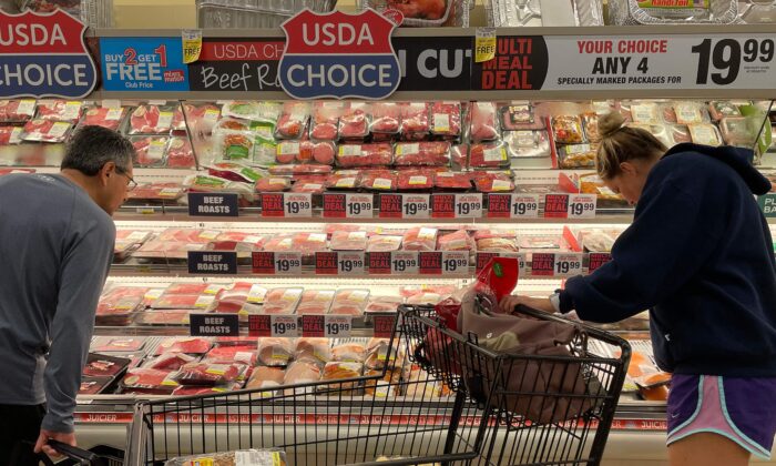 Consumers shop for meat at a grocery store in Annapolis, Md., on May 16, 2022. (Jim Watson/AFP/Getty Images)