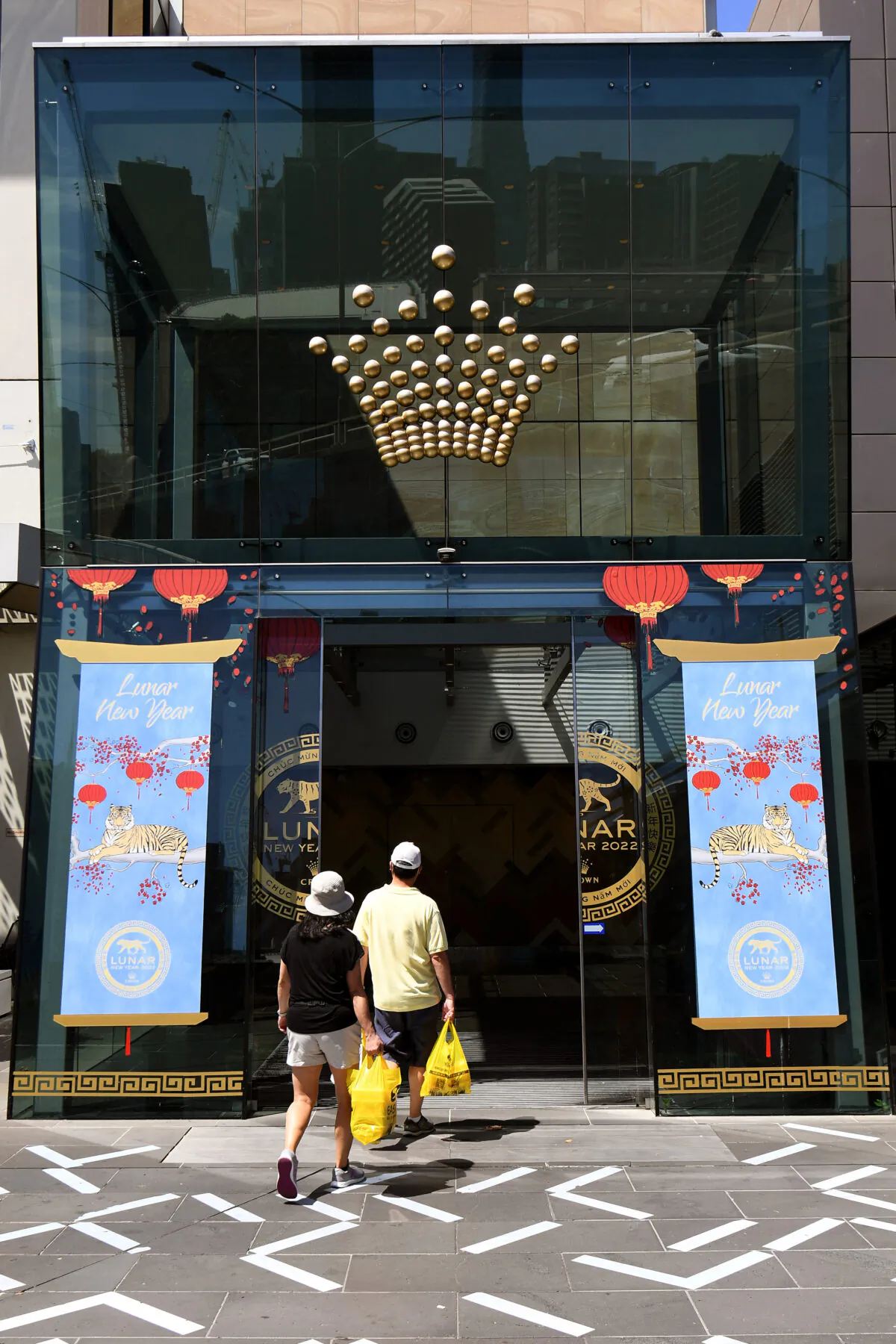 People enter the Crown Casino in Melbourne, Australia, on Feb. 14, 2022. (William West/AFP via Getty Images)