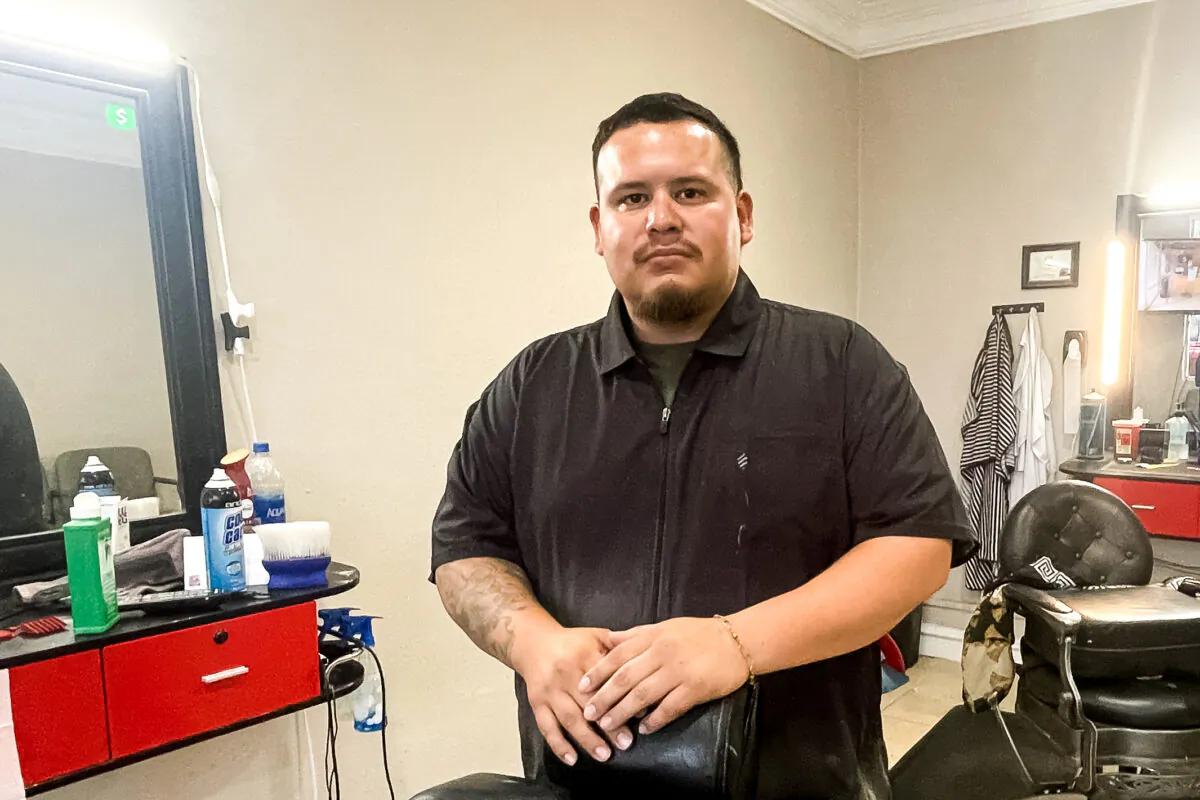 Steve Mena, owner of Official Cuts, in his barber shop in Uvalde, Texas, on May 31, 2022. (Charlotte Cuthbertson/The Epoch Times)