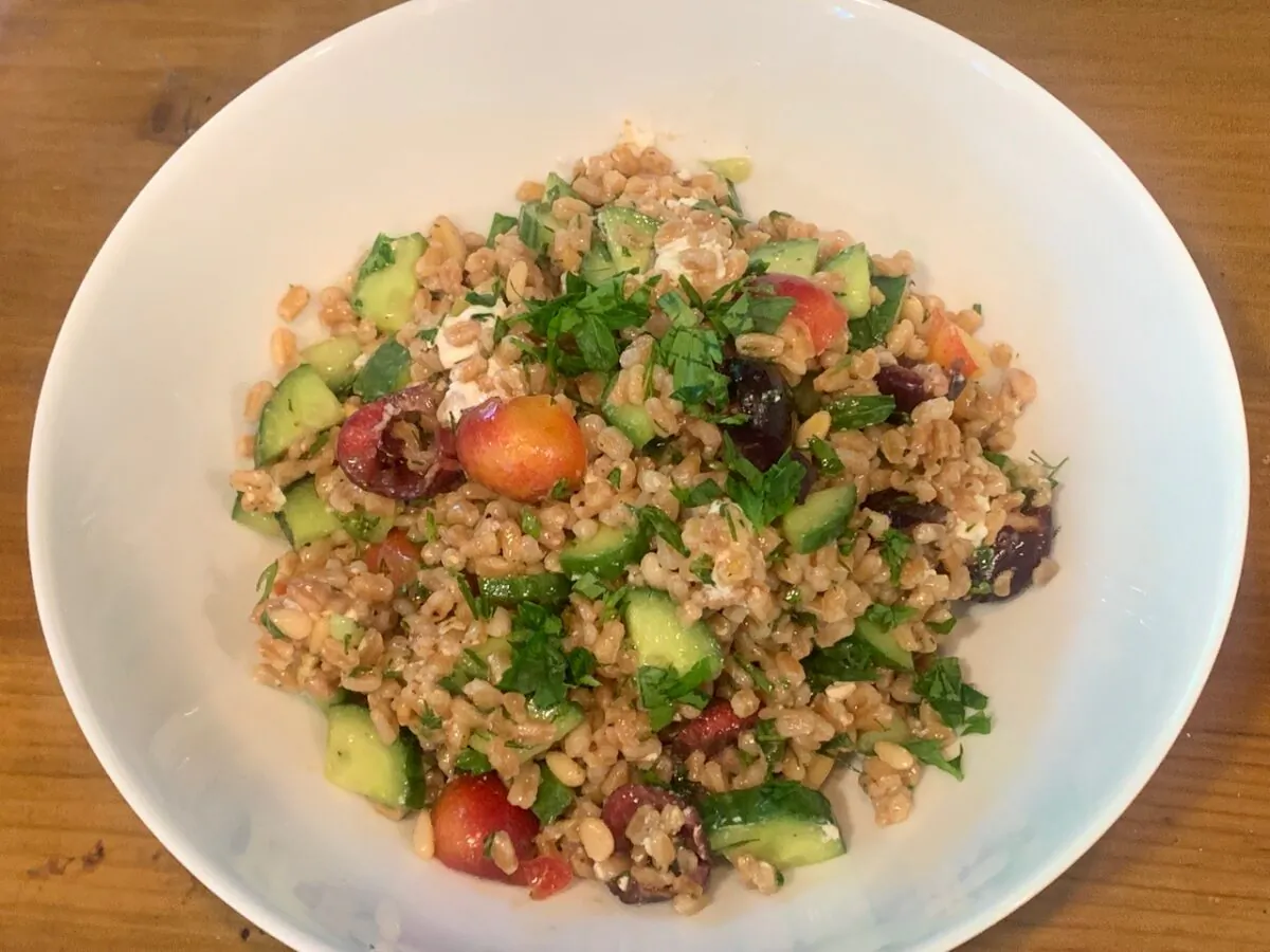 Nutty farro makes a hearty foundation for a cooling summer grain salad studded with cucumber chunks and cherries. (Dreamstime/TNS)
