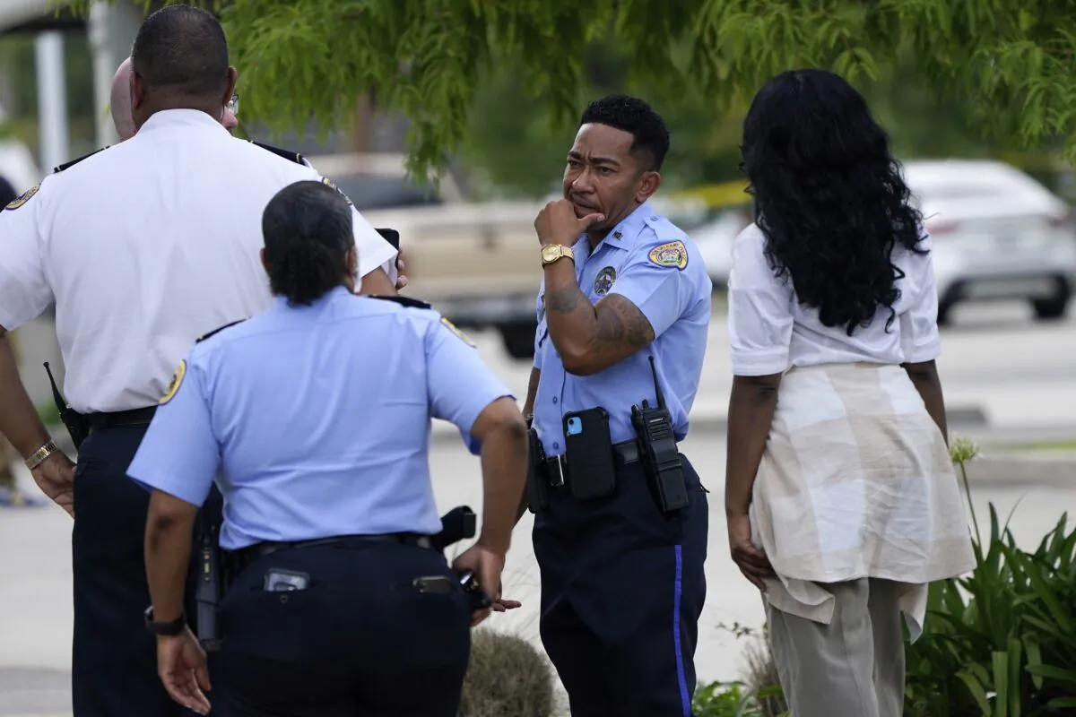 Investigators search the crime scene of a shooting at Xavier University in New Orleans on May 31, 2022. (Gerald Herbert/AP Photo)