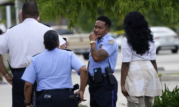 Investigators search the crime scene of a shooting at Xavier University in New Orleans on May 31, 2022. (Gerald Herbert/AP Photo)