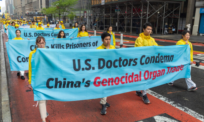 Falun Gong practitioners take part in a parade marking the 30th anniversary of the spiritual discipline's introduction to the public, in New York on May 13, 2022. (MarkZou/The Epoch Times)