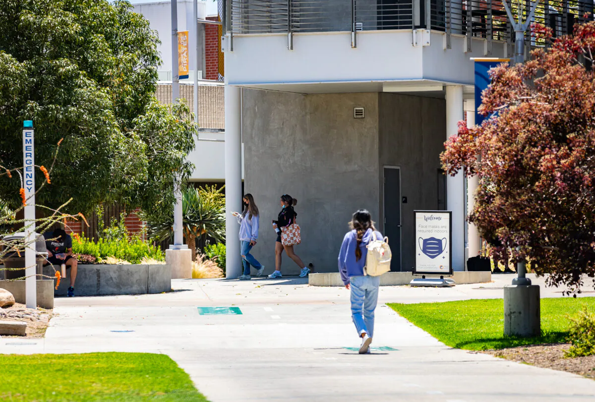 Students walk to classes at Orange Coast College in Costa Mesa, Calif., on June 29, 2022. (John Fredricks/The Epoch Times)