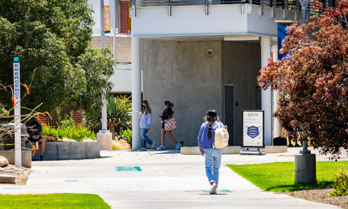 Students walk to summer semester classes at Orange Coast College in Costa Mesa, Calif., on June 29, 2022. (John Fredricks/The Epoch Times)
