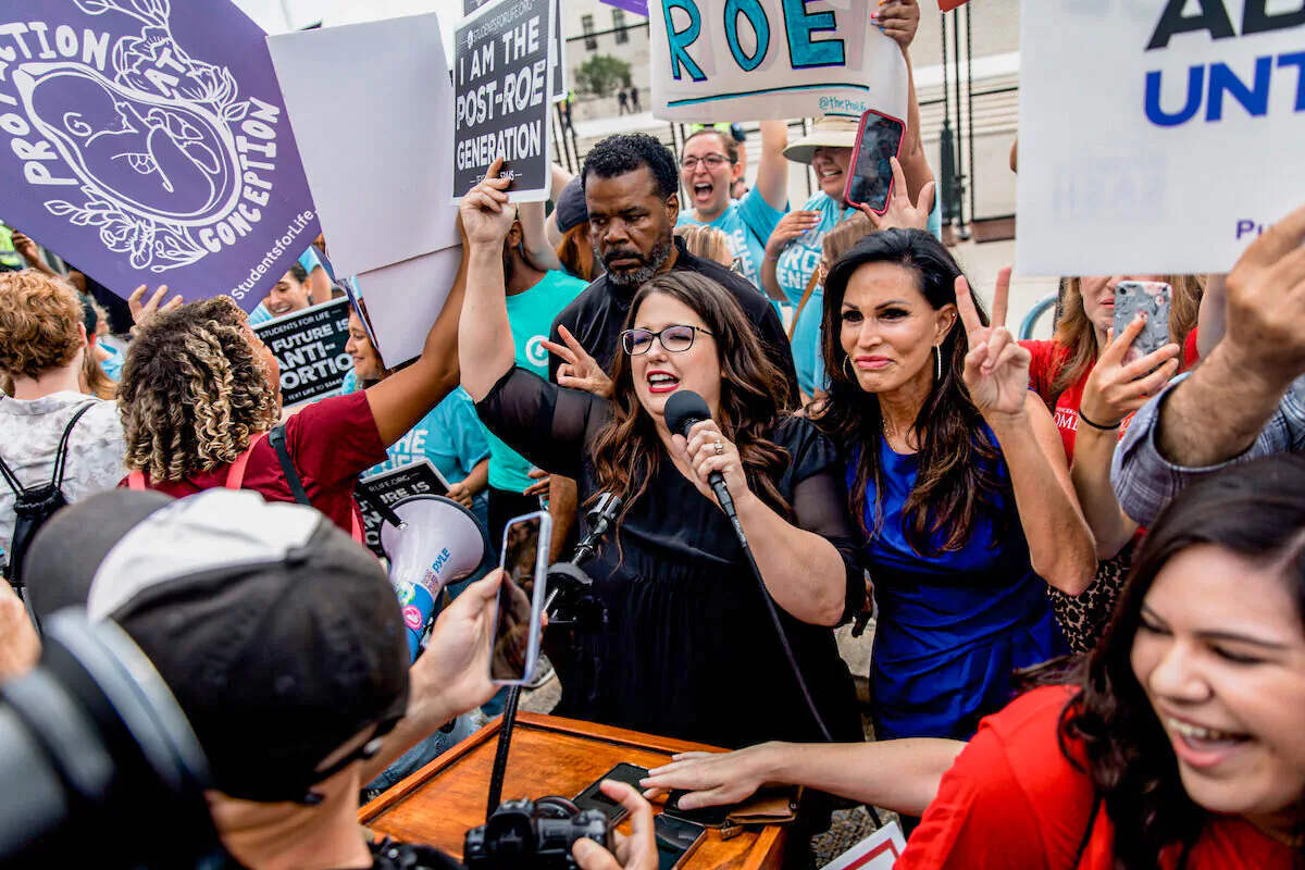 Pro-life leaders Kristan Hawkins (C) and Penny Nance (R) celebrate the overturning of Roe v. Wade in Washington on June 24, 2022. (Courtesy of Students for Life of America)