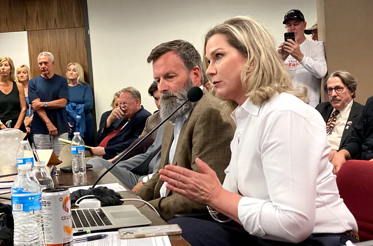 True the Vote founder and President Catherine Engelbrecht makes a point during a presentation on ballot trafficking at the Arizona statehouse on May 31, 2022. Seated next to her is True the Vote data investigator Gregg Phillips. (Allan Stein/The Epoch Times)