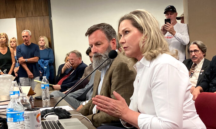 True the Vote founder and president Catherine Engelbrecht makes a point during a presentation on ballot trafficking at the Arizona statehouse on May 31, 2022. Seated next to her is True the Vote data investigator Gregg Phillips. (Allan Stein/The Epoch Times)