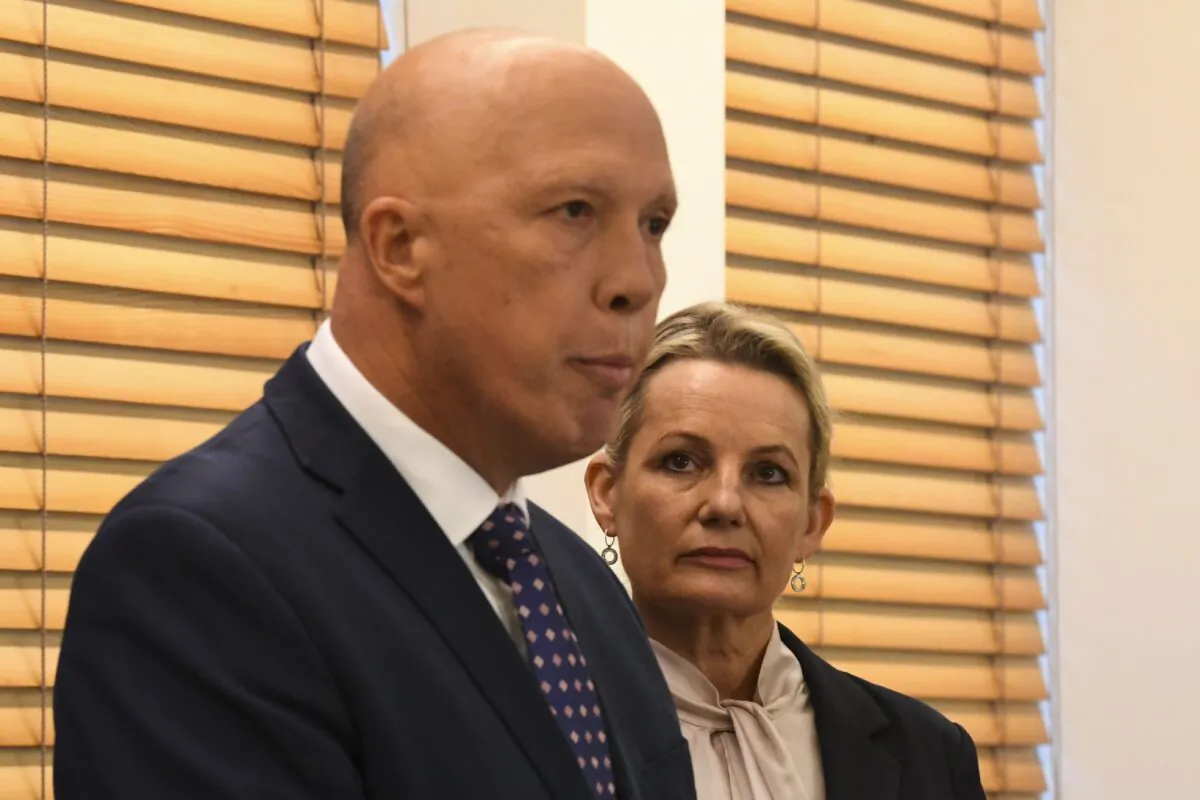 Deputy Leader of the Liberal Party Sussan Ley (right) listens to newly elected Leader of the Liberal Party Peter Dutton speak to the media after a party room meeting at Parliament House in Canberra, Australia on May 30, 2022. (AAP Image/Lukas Coch)