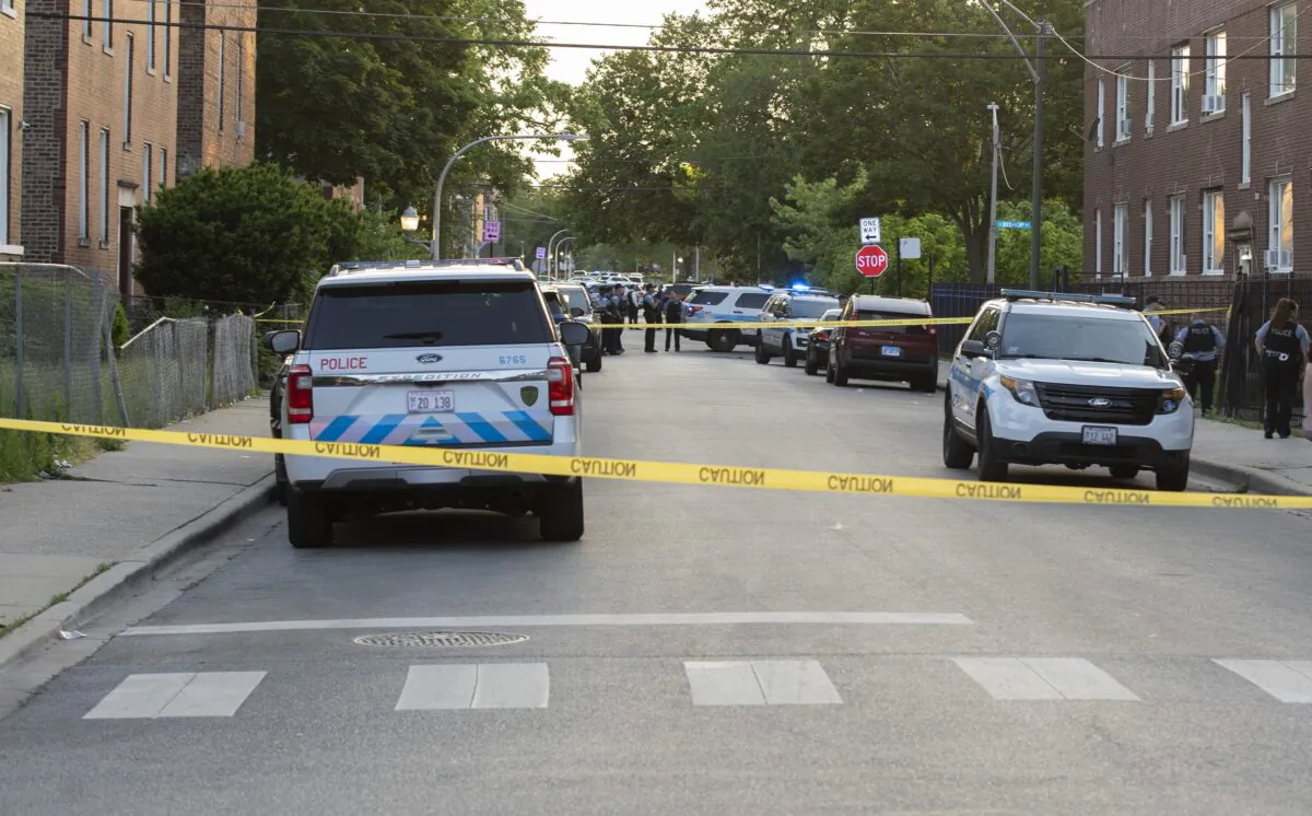 Chicago Police set up near the corner of 64th St. and Loomis Blvd., an intersection near the location where an officer was shot, in Chicago, on June 1, 2022. (Brian Rich/Chicago Sun-Times via AP)