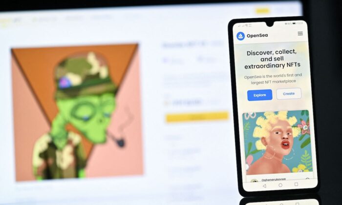 A NFT (Non-Fungible Token) created by Nigerian digital artist FreddieJacobArt as featured on the OpenSea NFT marketplace, displayed on a phone, and Binance NFT marketplace displayed on a computer screen. (Justin Tallis/AFP via Getty Images)