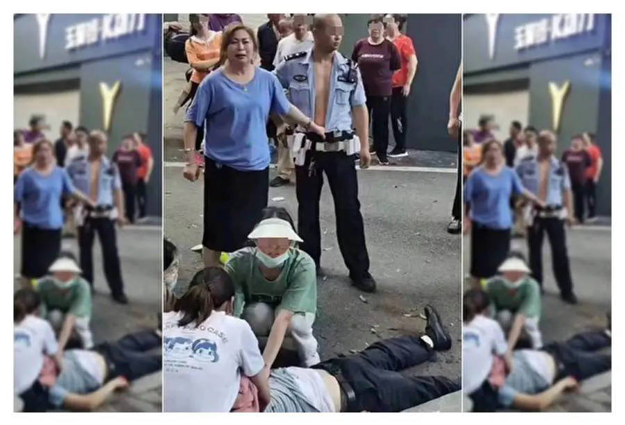 Screenshot from an online video that shows a man (on the ground) fatally shot by a policeman (R), standing next to the man's wife, in Chongqing city, China, on May 30, 2022. (The Epoch Times)