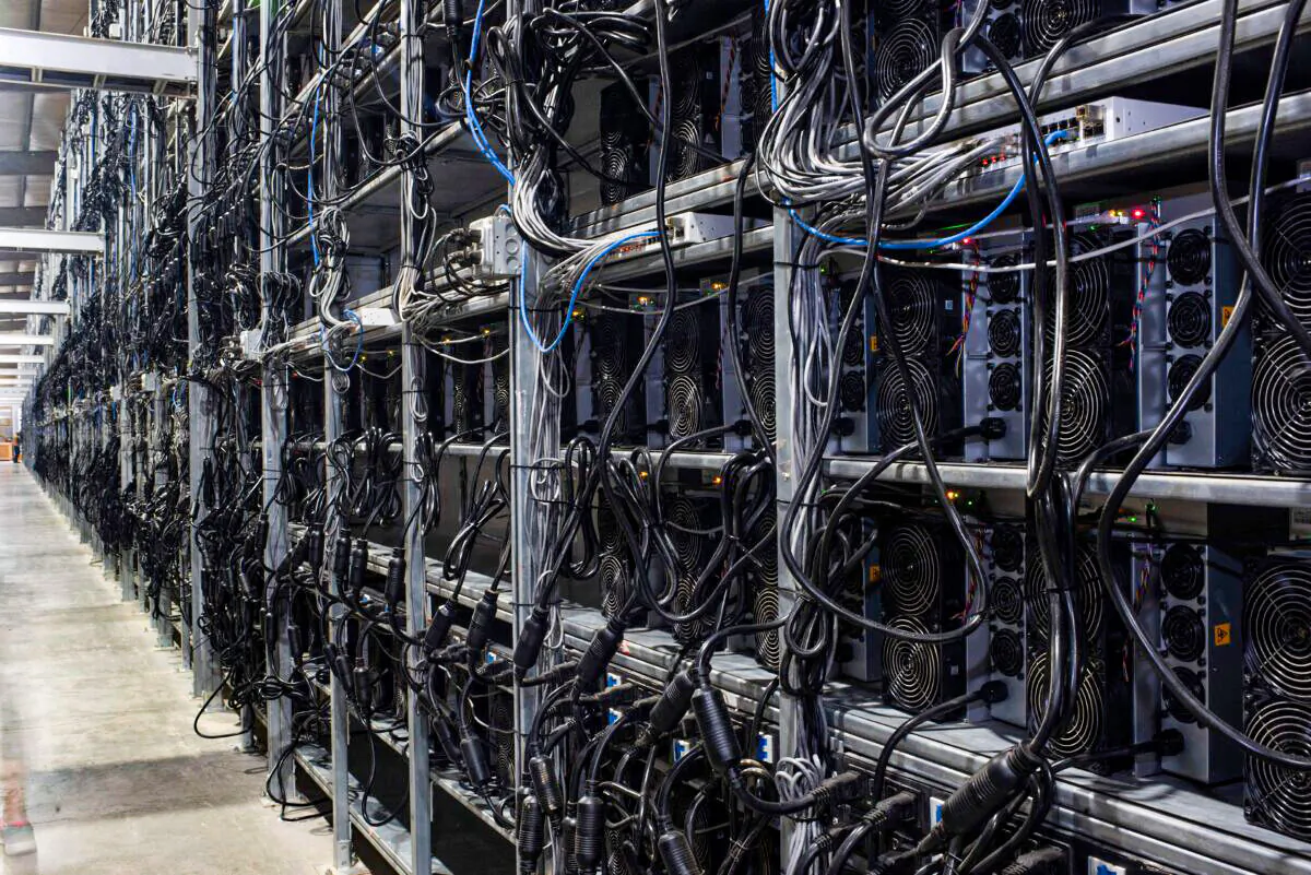 Bitcoin mining machines in a warehouse at a mining facility in Rockdale, Texas, on Oct. 10, 2021. (Mark Felix/AFP/Getty Images/TNS)