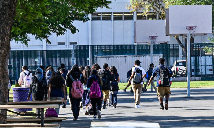 Students walk to their classrooms at a public middle school in Los Angeles, California, on Sept. 10, 2021. (Robyn Beck/AFP via Getty Images)