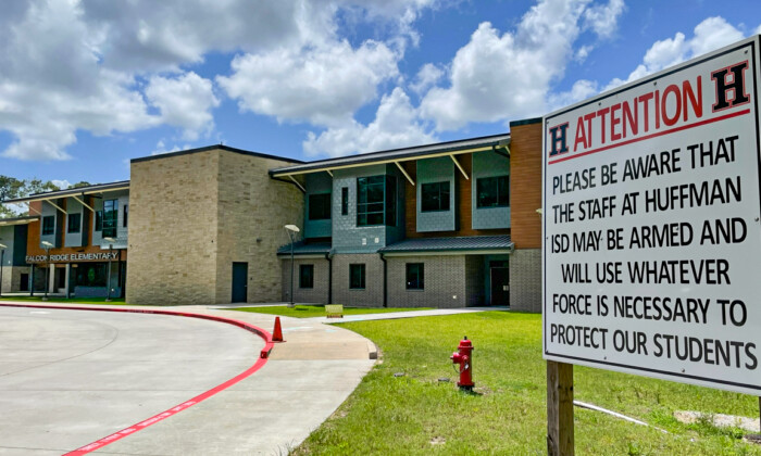 A sign posted at Falcon Elementary School in the Huffman Independent School District in Huffman County, Texas, warns anyone who may enter school grounds with ill intent that armed staff members will use whatever force is necessary to protect the children in their charge. (Courtesy of the Huffman Independent School District.)