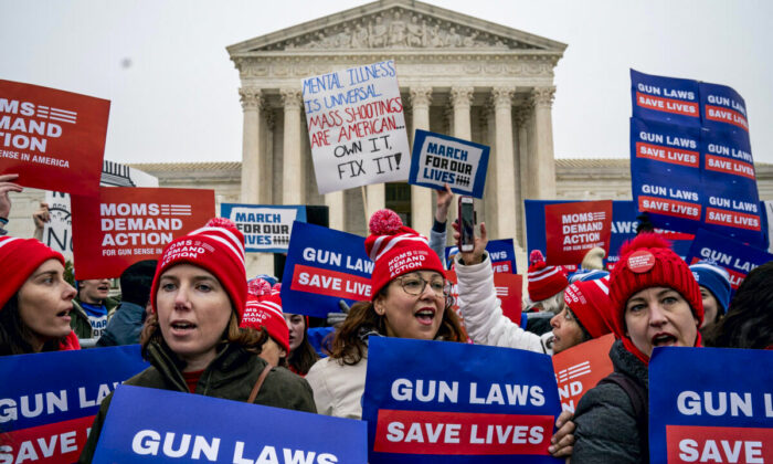 Gun safety advocates rally in front of the U.S. Supreme Court during oral arguments in the Second Amendment case NY State Rifle & Pistol v. City of New York, N.Y., in Washington, on Dec. 2, 2019. (Drew Angerer/Getty Images)