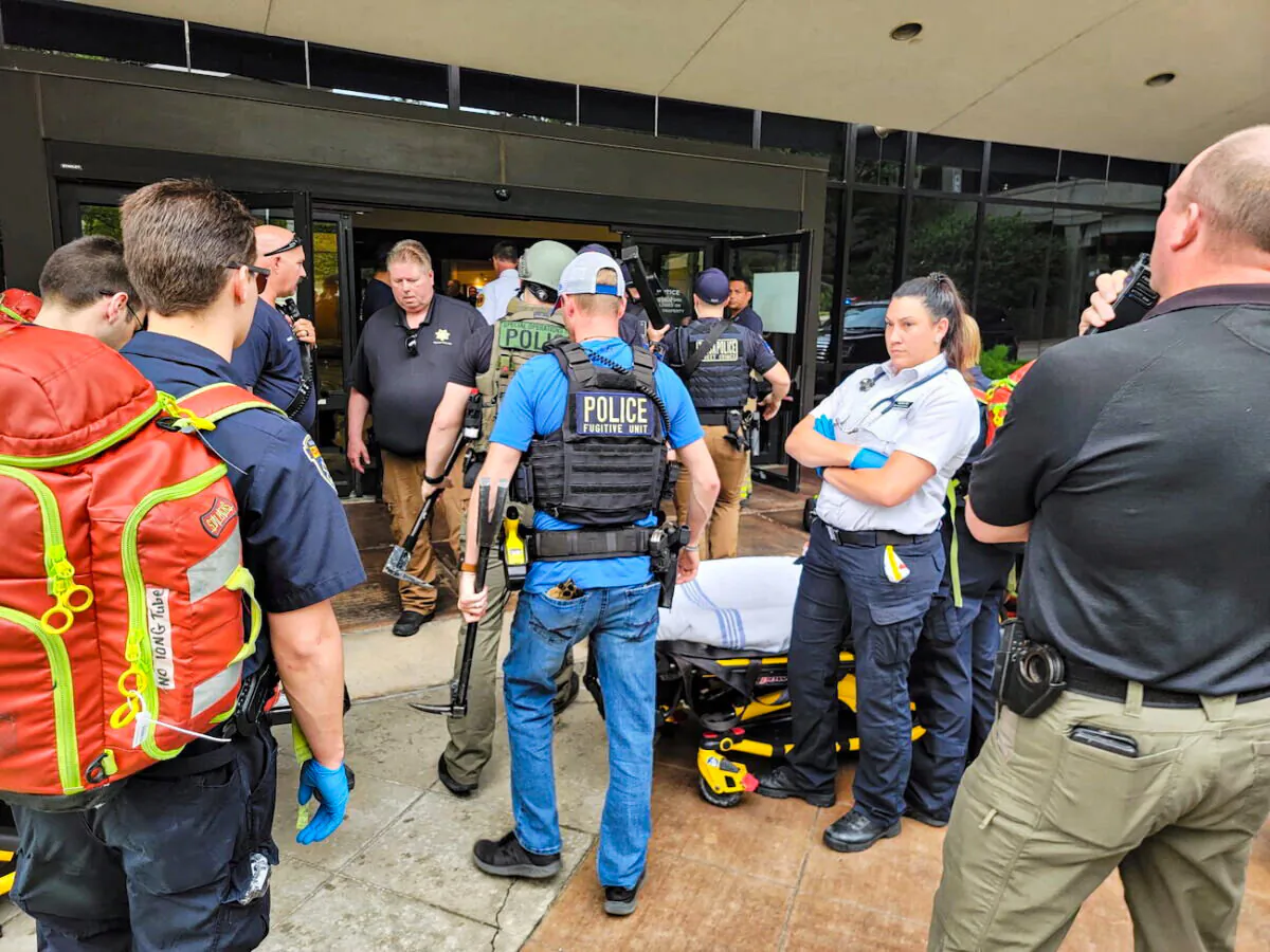 Emergency personnel work at the scene of a shooting at the Warren Clinic in Tulsa, Oklahoma, on June 1, 2022. (Tulsa Police/Handout via Reuters)