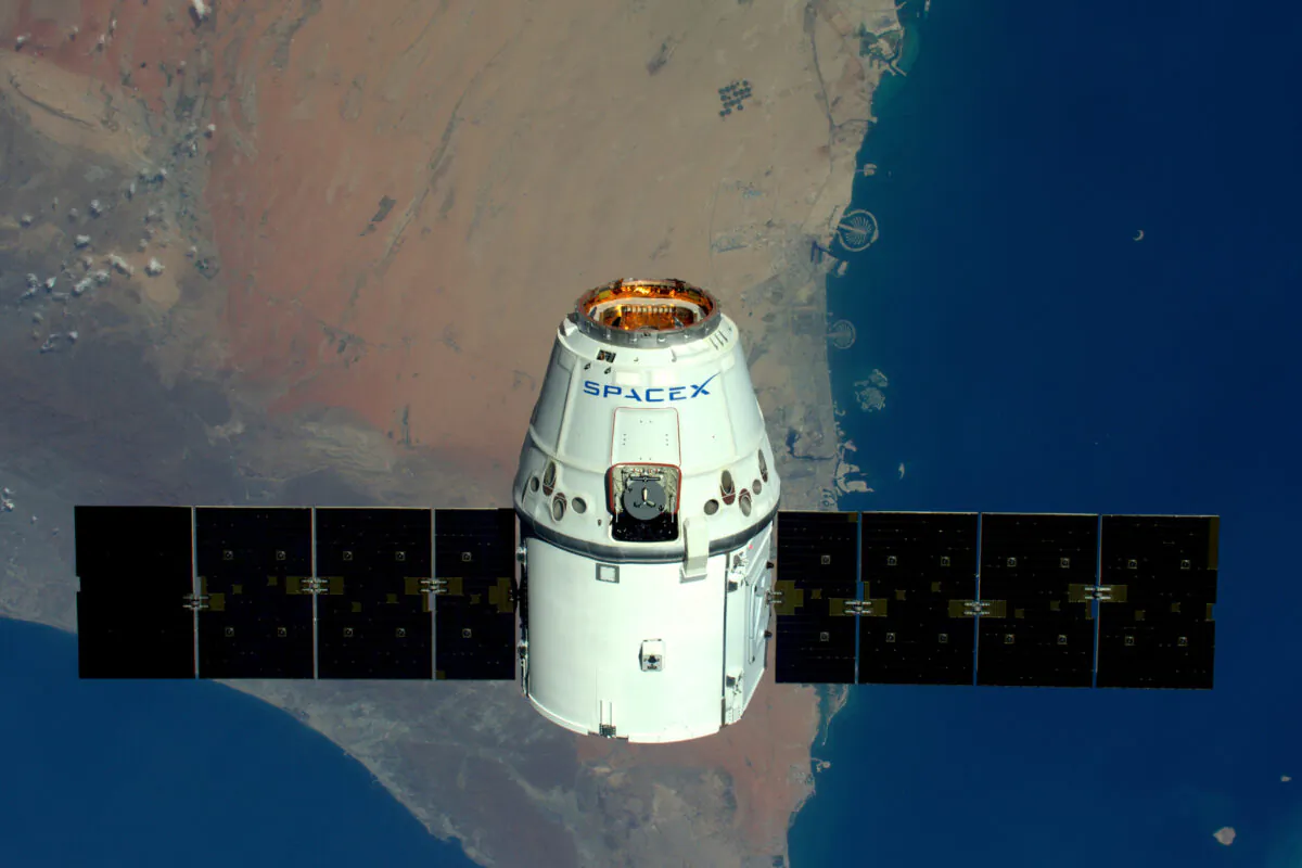 This handout image supplied by the European Space Agency (ESA), shows a view of The Palms, Dubai as the SpaceX Dragon spacecraft psses below, in an image taken by ESA astronaut Tim Peake from the International Space Station on April 10, 2016. (Tim Peake / ESA/NASA via Getty Images)