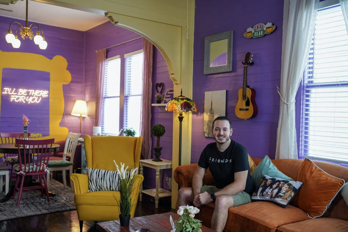 Airbnb superhost Frank Albert poses for a portrait in the rental that he and his friends designed to commemorate the "Friends" sitcom in Ybor City, Florida. (Aya Diab/Tampa Bay Times/TNS)