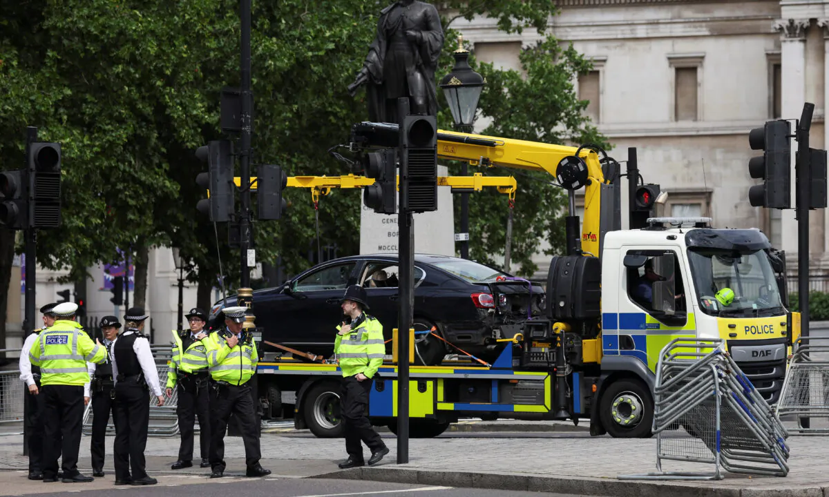 A police vehicle removes a car following a security incident near Trafalgar Square, as Queen Elizabeth's Platinum Jubilee celebrations continue, in London on June 4, 2022. (Phil Noble/Reuters)