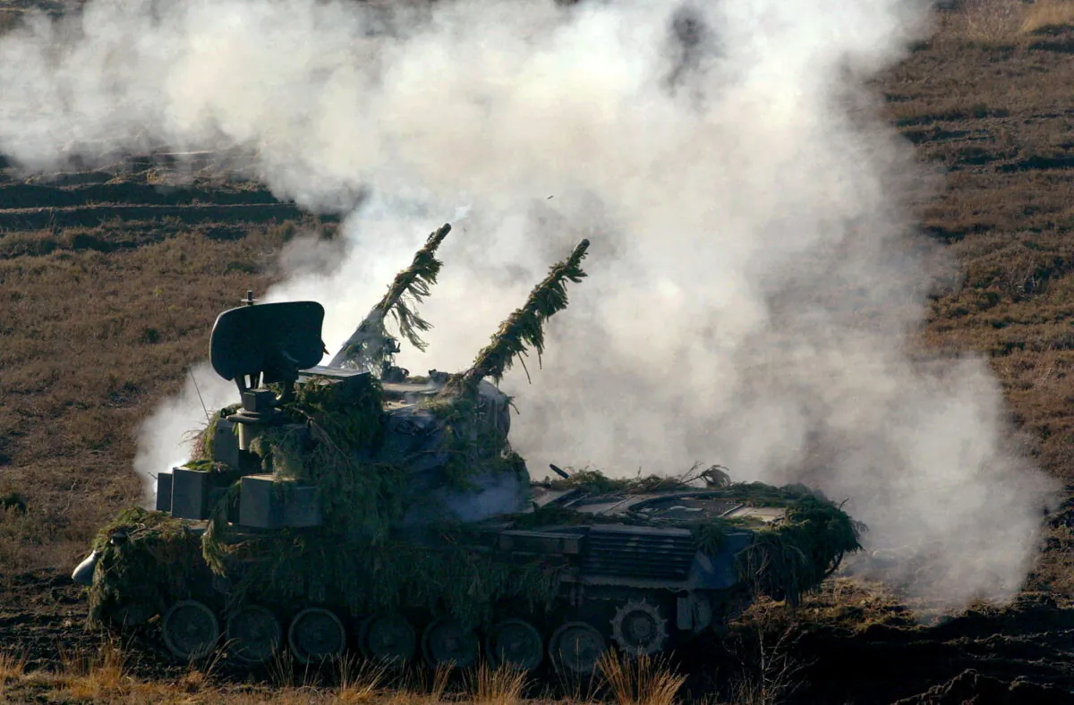 A German Gepard anti-aircraft tank fires during a military exercise in the northern German town of Bergen some 80 km south of Hamburg, Germany, on Nov. 26, 2003. (Christian Charisius/Reuters)
