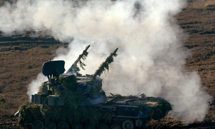 A German Gepard anti-aircraft tank fires during a military exercise in the northern German town of Bergen some 80 km south of Hamburg, Germany, on Nov. 26, 2003. (Christian Charisius/Reuters)