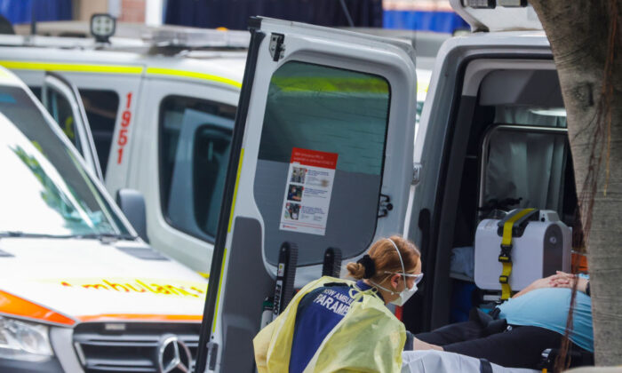 A paramedic unloads a patient from an ambulance at Royal Prince Alfred Hospital on January 10, 2022 in Sydney, Australia. (Jenny Evans/Getty Images)