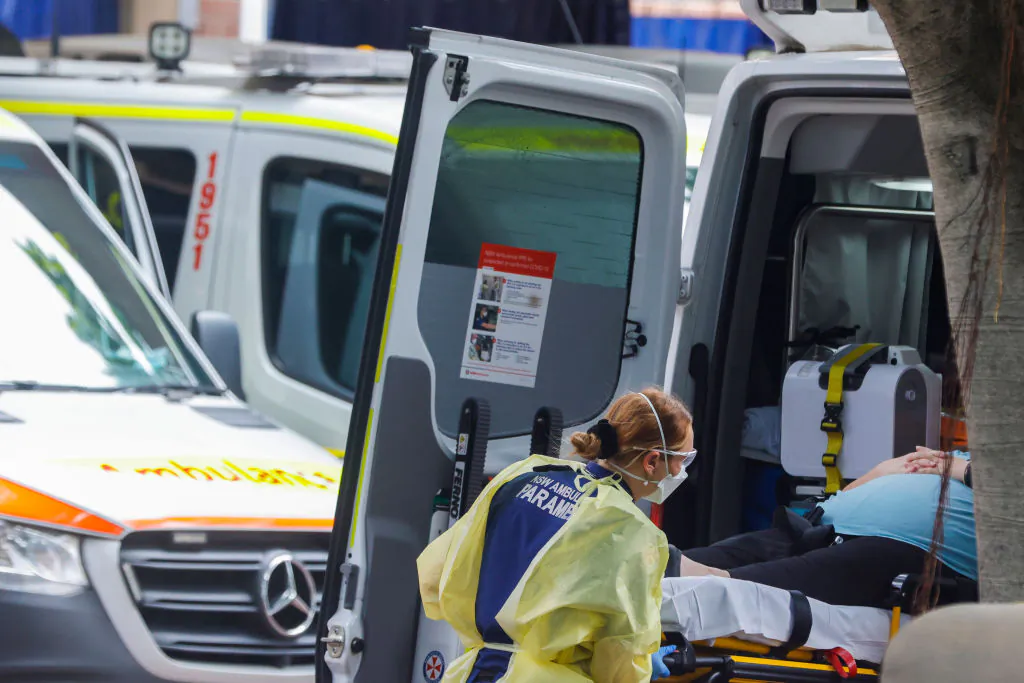 A paramedic unloads a patient from an ambulance at Royal Prince Alfred Hospital on January 10, 2022 in Sydney, Australia. (Jenny Evans/Getty Images)