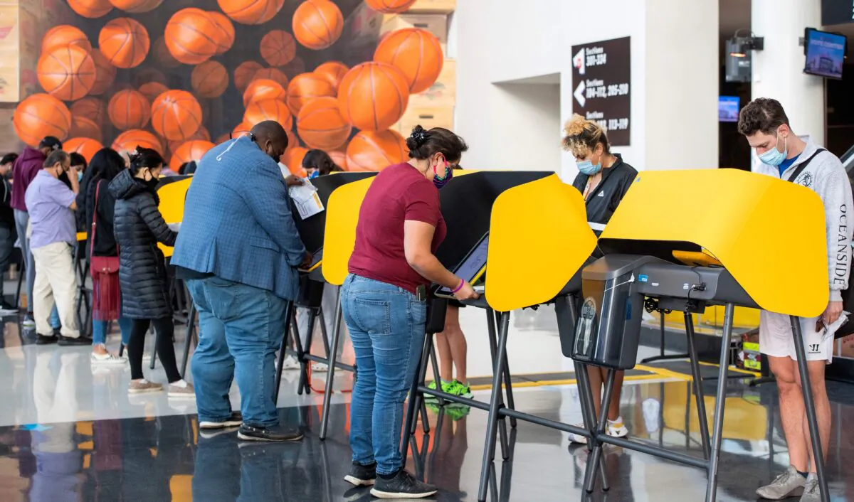 People vote at the Staples Center in Los Angeles on Nov. 3, 2020. (Valerie Macon/AFP via Getty Images)