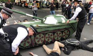 British Police Stand in Way of Tank Symbolising Tiananmen Square Protests