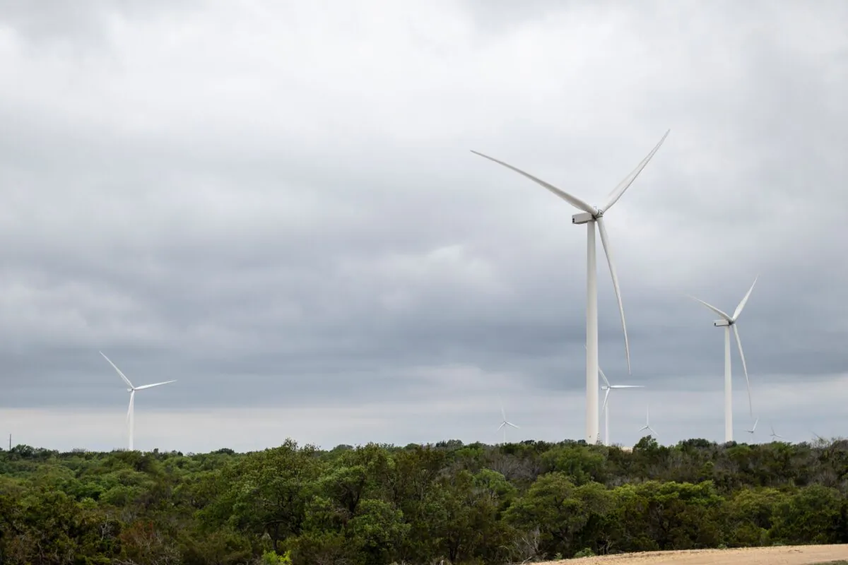 Blades from a wind turbine rotate in a field, April 16, 2021 near Eldorado, Texas. (SERGIO FLORES/AFP via Getty Images)