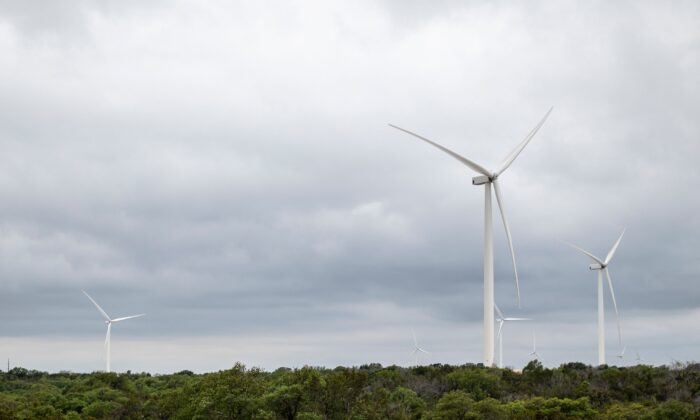 Blades from a wind turbine rotate in a field, April 16, 2021 near Eldorado, Texas. (SERGIO FLORES/AFP via Getty Images)