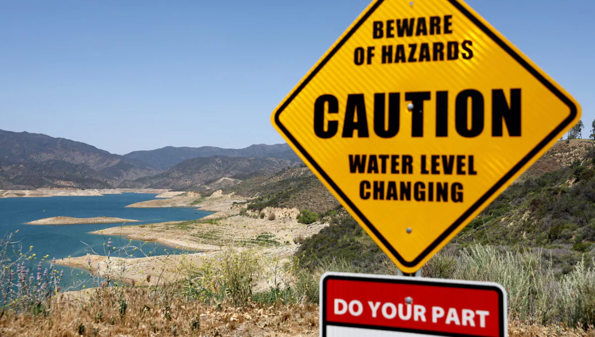 A caution sign is posted at the Castaic Lake reservoir in Los Angeles County in Castaic, California, on May 3, 2022. (Mario Tama/Getty Images)