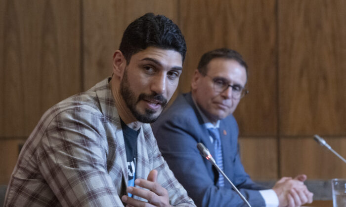 Basketball player and human rights defender Enes Kanter Freedom (L) takes part in news conference with Canadian Sen. Leo Housakos calling on the Canadian government to ban imports of goods made with forced labour in Xinjiang region of China, in Ottawa on June 6, 2022. (Fred Chartrand/The Canadian Press)