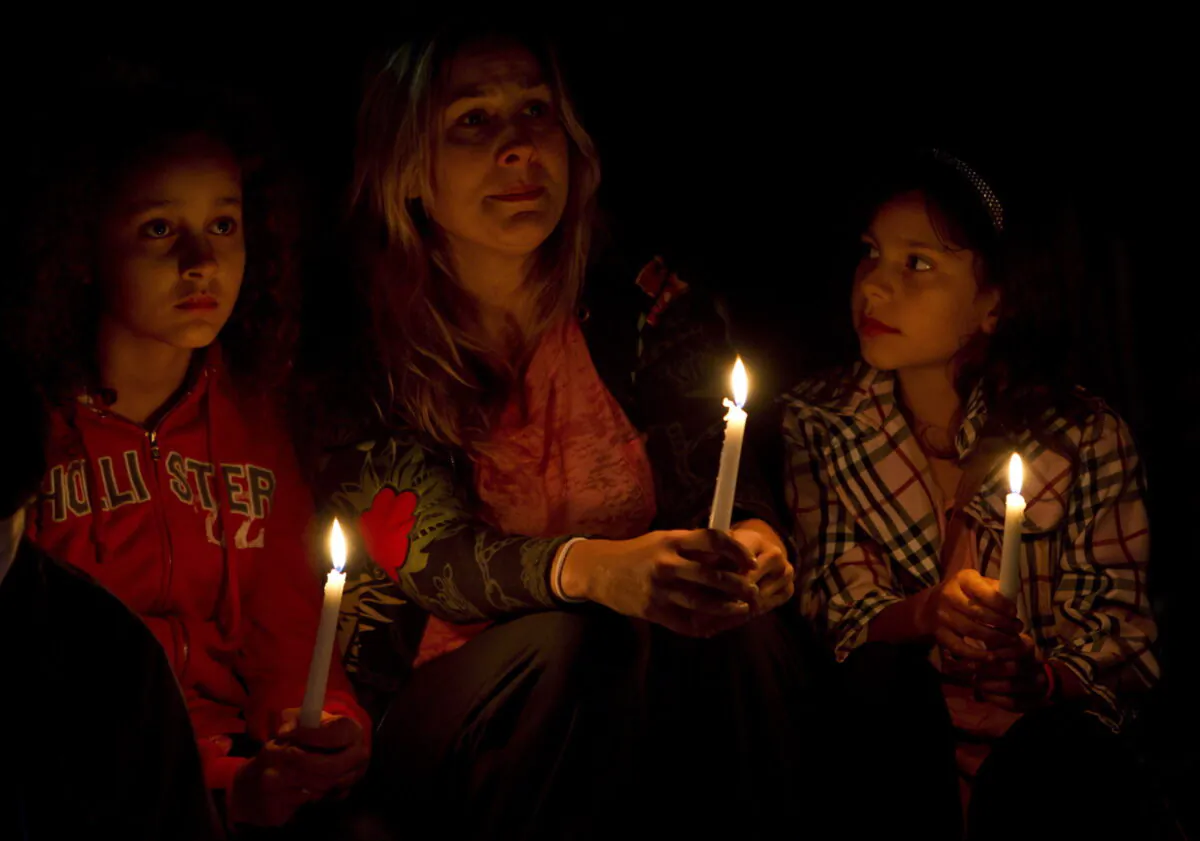 People gather during a memorial for Amanda Todd in Surrey, B.C., Oct. 19, 2012. (The Canadian Press/Jonathan Hayward)