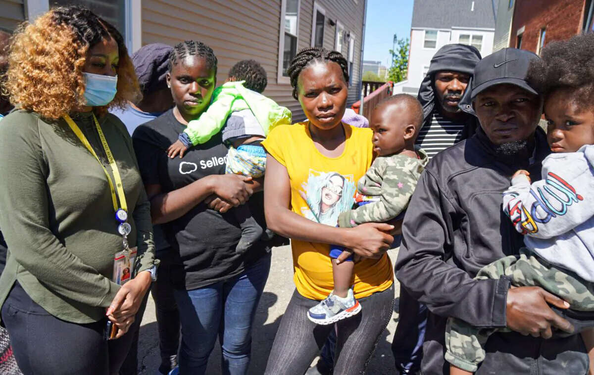 Families of asylum-seekers warehoused outside of an overcrowded family shelter in Portland, Maine, on May 25, 2022. (Steven Kovac/The Epoch Times)