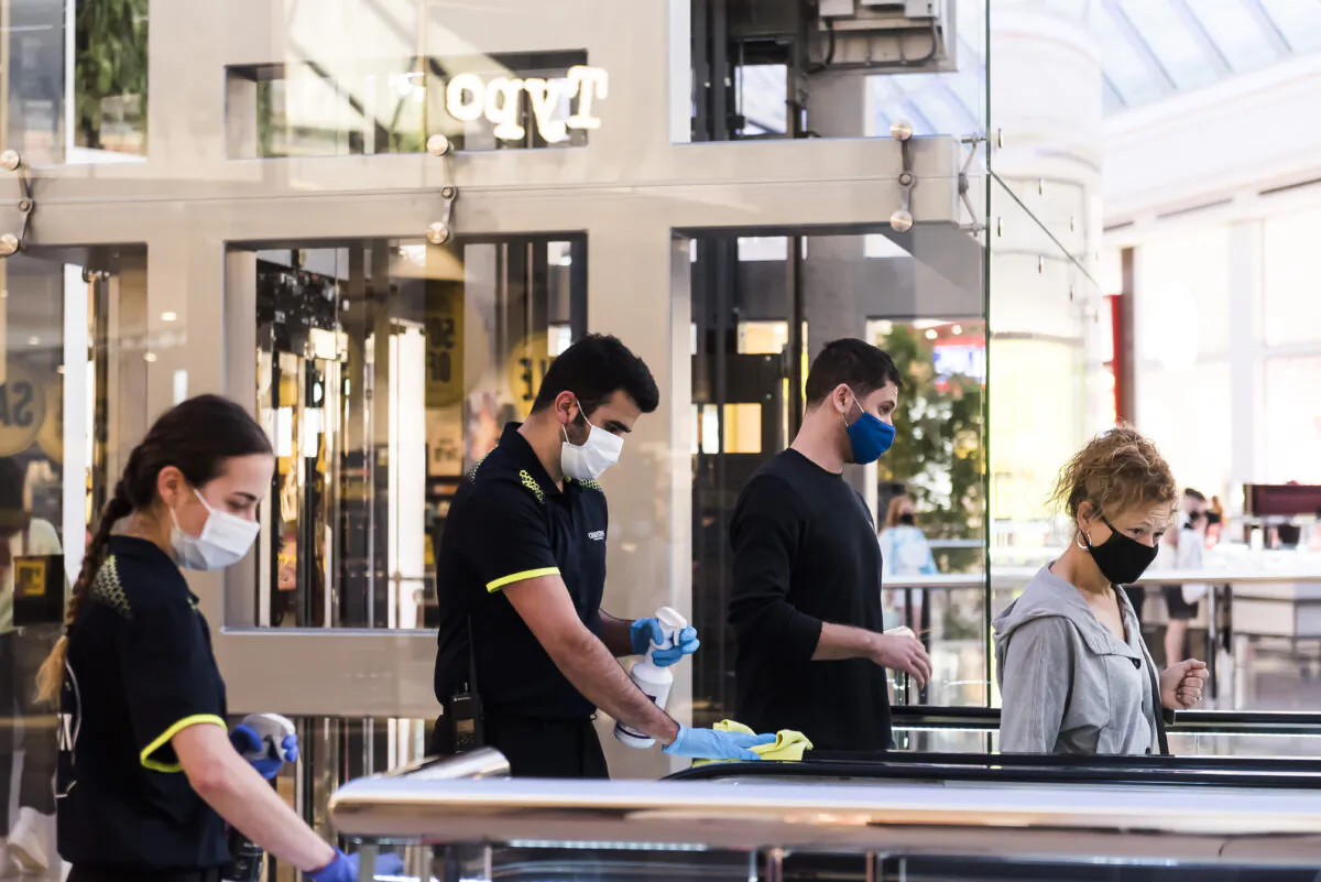 Employees maintain COVID-19 safety with frequent cleaning at Chadstone the Fashion Capital in Melbourne, Australia, on Dec. 26, 2020. (Naomi Rahim/Getty Images)