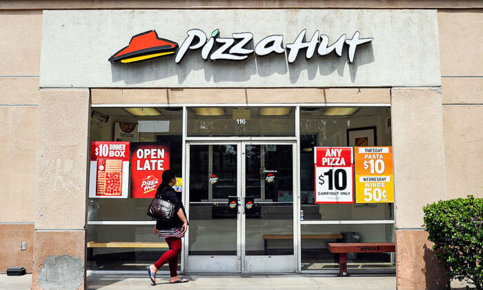 A customer walks in to a Pizza Hut restaurant.  (Kevork Djansezian/Getty Images)