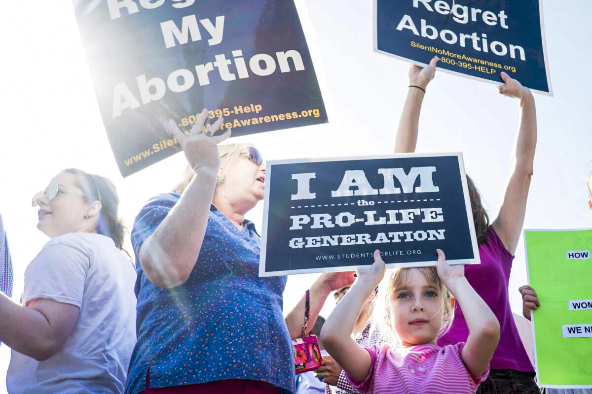 Pro-life activists demonstrate on the steps of the U.S. Supreme Court in Washington on June 27, 2016. (Pete Marovich/Getty Images)