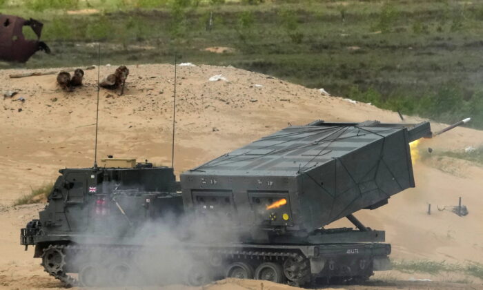 The British Army's M270 Multiple Launch Rocket System (MLRS) fires during Summer Shield 2022 military exercise in Adazi military base, Latvia, on May 27, 2022. (Ints Kalnins /Reuters)