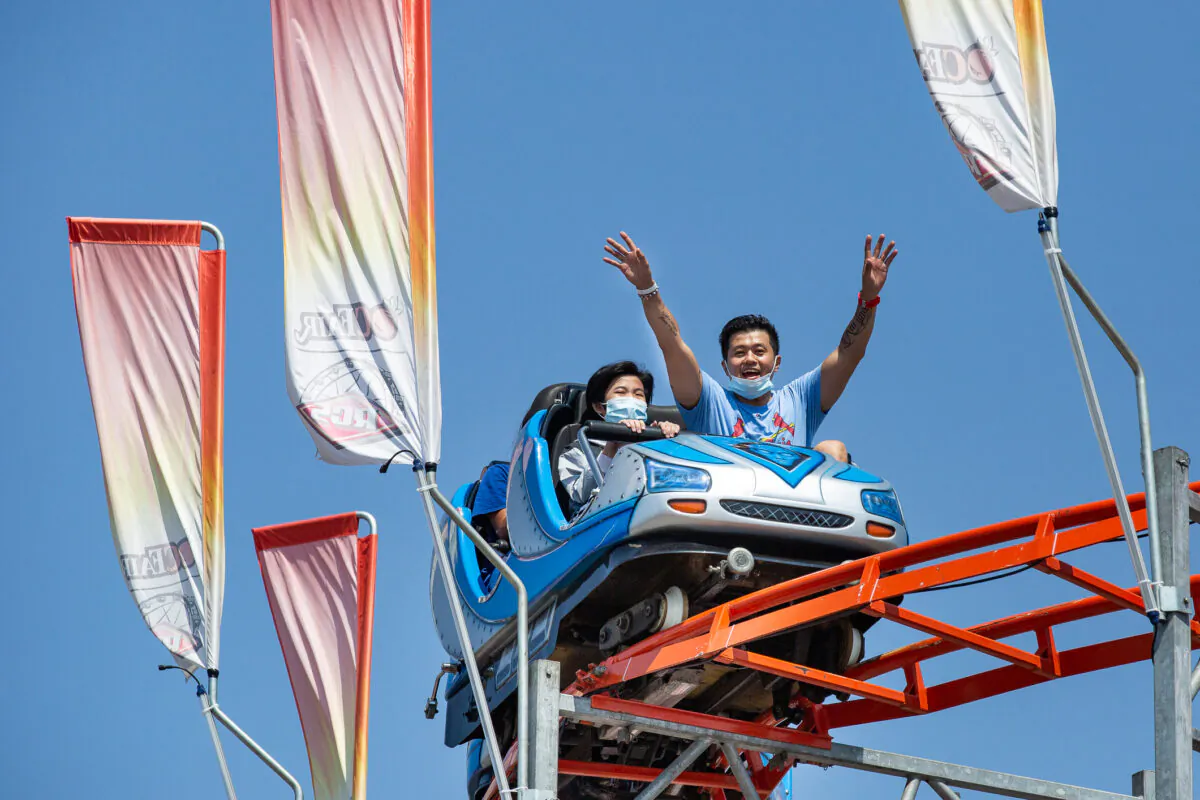 People enjoy opening day of the Orange County Fair in Costa Mesa, Calif., on July 16, 2021. (John Fredricks/The Epoch Times)