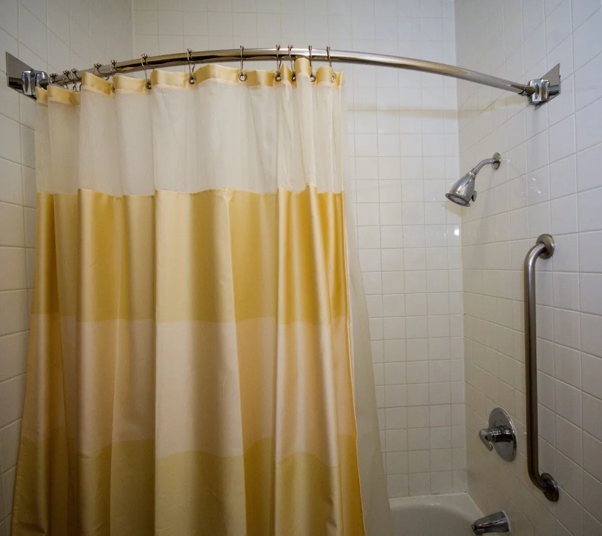 The rod fits a standard 5-foot tub and is installed with mounting brackets and hardware.  (Gene Hamilton/TNS)
