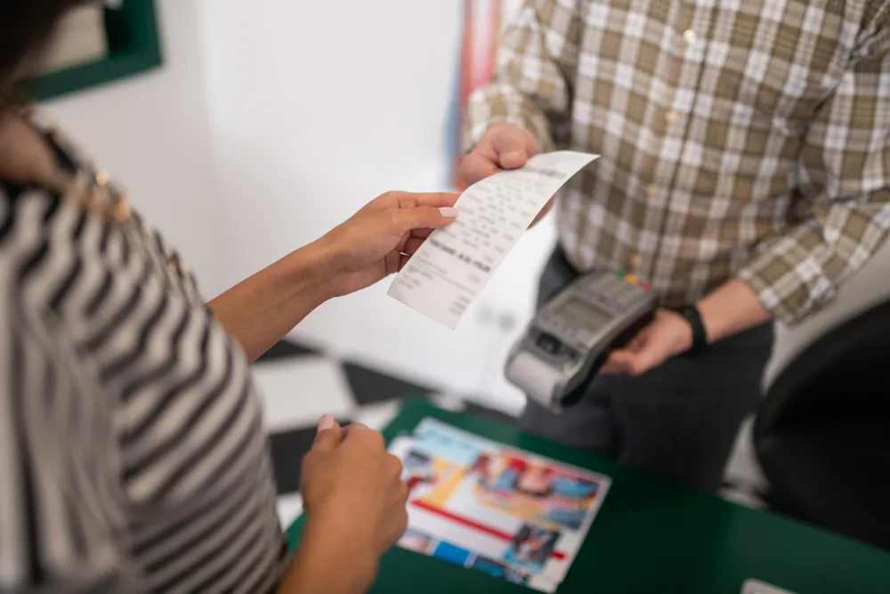 Taking hold of a receipt can transfer BPA to our fingers, especially if they’re wet or greasy.  (ShutterStock)