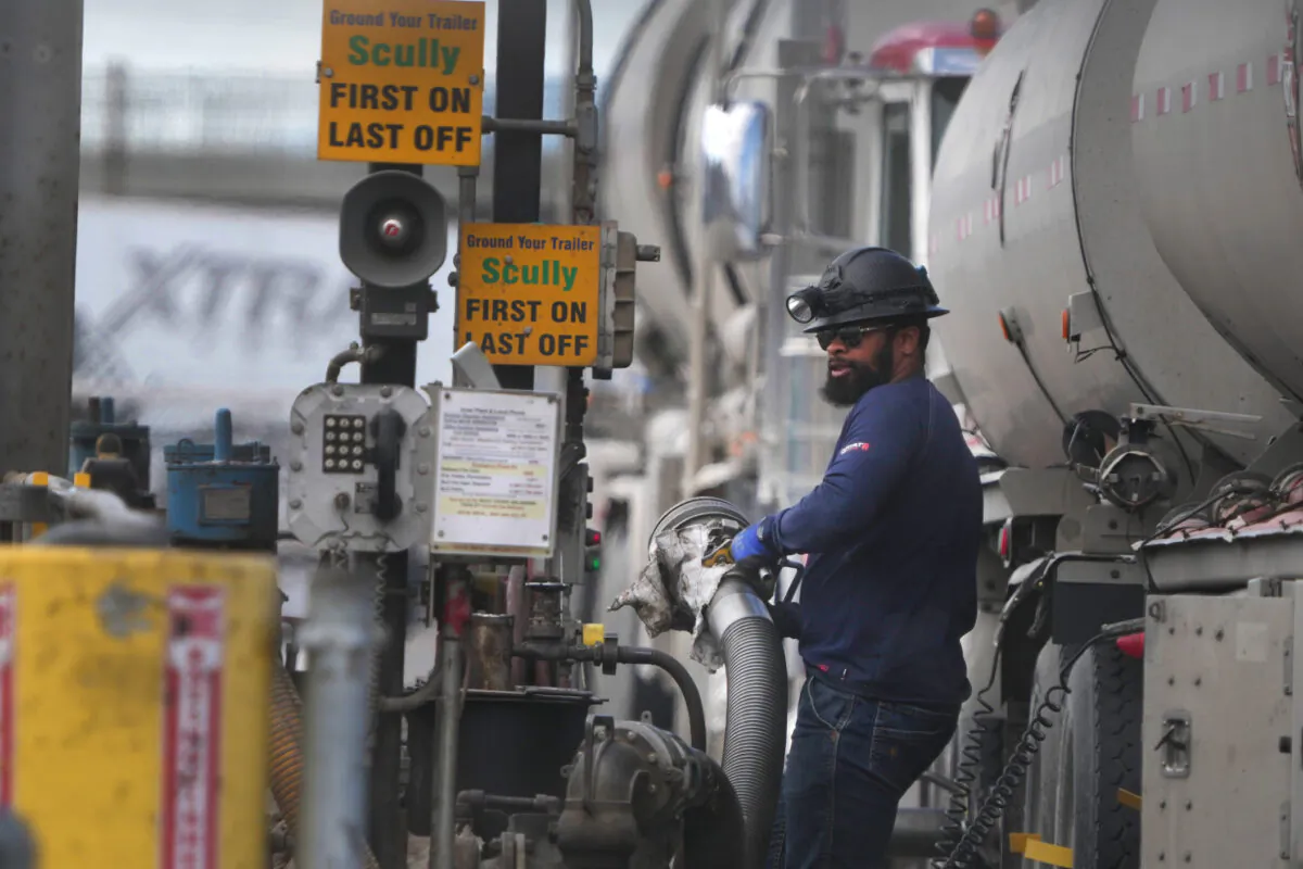A driver unloads raw crude oil from his tanker to process into gas at Marathon Refinery in Salt Lake City, Utah., on May 24, 2022. (George Frey/Getty Images)