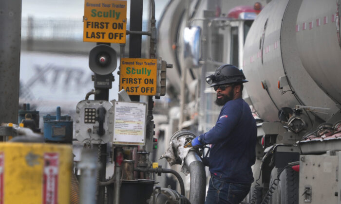 A driver unloads raw crude oil from his tanker to process into gas at Marathon Refinery in Salt Lake City, Utah., on May 24, 2022.  (George Frey/Getty Images)