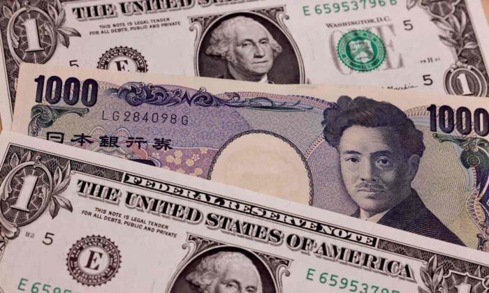 Japanese 1,000 yen and 1 U.S. Dollar banknotes in Tokyo on April 13, 2022.  (Behrouz Mehri/AFP via Getty Images)